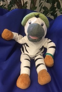 Kuscheltier Franz, ein Plüschtier-Zebra als Maskottchen
